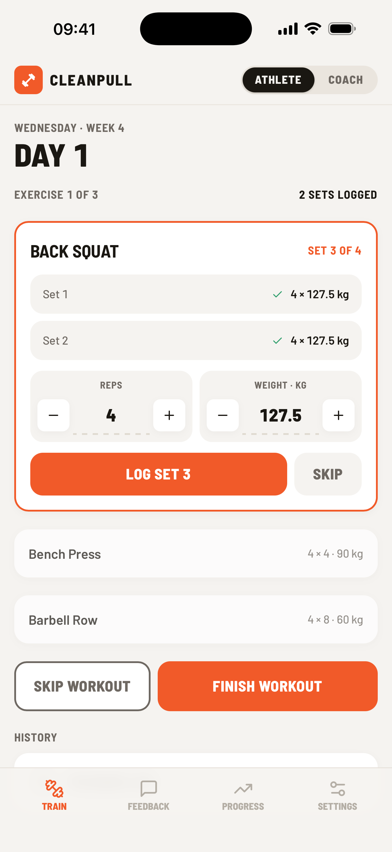 Active workout with two completed squat sets and controls for the next set